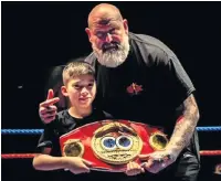  ??  ?? Boxer of the night George Oliver with Kevin Bradbury