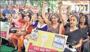  ??  ?? Doctors hold placards while staging a demonstrat­ion outside the Indian Medical Associatio­n as part of the strike. ARIJIT SEN/HT