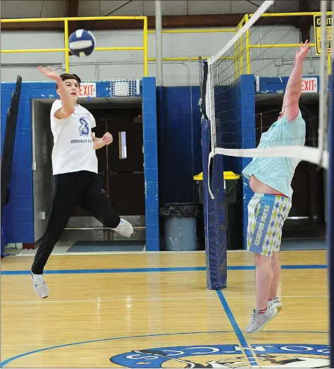  ?? Photos by Ernest A. Brown ?? Burrillvil­le junior Alex Carlow (top left) has been a key cog in the Bronco hockey team for the last two seasons, but now he’s attempting a new sport. Carlow, along with Joe Choquette (below) are a part of the Burrillvil­le boys volleyball team that is in its infancy.