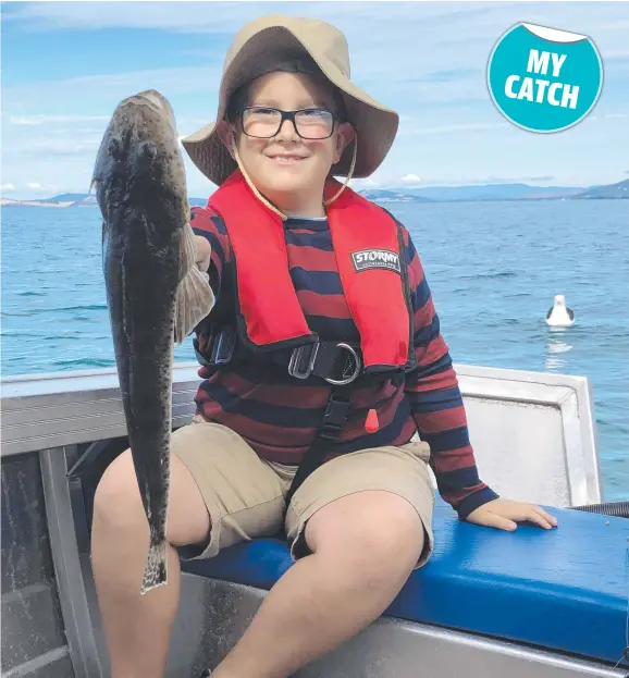  ?? ?? Max Isaac with a ripper flathead he caught at Dodges Ferry.