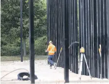  ?? DAN JANISSE ?? Crews work at the former RONA store on Lauzon Parkway Thursday. A Lowe’s store is to open soon at the location.