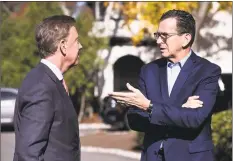  ?? Jessica Hill / Associated Press file photo ?? Former Gov. Dannel P. Malloy, right, talks with Gov. Ned Lamont days after he was elected last November.