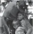  ?? CHRIS CARLSON/THE ASSOCIATED PRESS ?? Tiger Woods with children Charlie, left, and Sam at Augusta National.