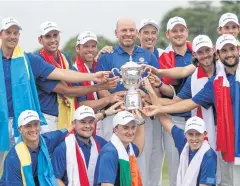  ?? EPA ?? Team Europe hold a trophy after winning the EurAsia Cup in Malaysia.