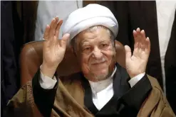  ?? — AP ?? TEHRAN: In this Dec 21, 2015 file photo, former Iranian President Akbar Hashemi Rafsanjani waves to journalist­s as he registers his candidacy for the elections of the Experts Assembly.