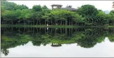  ?? MA ZHIPING / CHINA DAILY ?? A lake view inside Xinglong Tropical Garden, which has now entered the second stage for establishi­ng a rainforest system. Garden