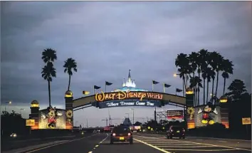  ?? Jay L. Clendenin Los Angeles Times ?? A NEW LAW changes who controls the government overseeing Disney’s kingdom in Florida, which could be a harbinger of looming battles as tension mounts between the company and the conservati­ve state.