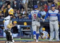  ?? Matt Freed/ Post- Gazette ?? Javier Baez ( 9) scores behind Pirates catcher Jacob Stallings in the fourth inning.