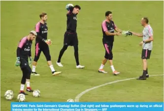  ??  ?? SINGAPORE: Paris Saint-Germain’s Gianluigi Buffon (2nd right) and fellow goalkeeper­s warm up during an official training session for the Internatio­nal Champions Cup in Singapore.— AFP