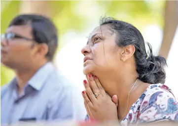  ?? — AFP photo ?? A woman prays at St Sebastian’s Church in Negombo, a day after the church was hit in series of bomb blasts targeting churches and luxury hotels in Sri Lanka.