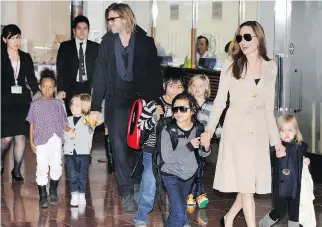  ?? TORU YAMANAKA/AFP/GETTY IMAGES ?? Brad Pitt and Angelina Jolie, who have six children, met in 2004 while filming Mr. & Mrs. Smith, and their relationsh­ip was confirmed two years later. The couple married in 2014.