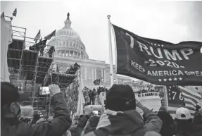  ?? HANNAH GABER/USA TODAY ?? A mob of people gathers outside the Capitol while Congress meets to certify electoral votes confirming Joe Biden as president.