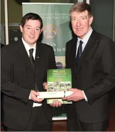  ??  ?? Conor Nelligan, Heritage Officer Cork County Council, presenting a certificat­e to Cllr Ian Doyle, of Charlevill­e Heritage Society, to mark Charlevill­e’s participat­ion in the 1916 Centenary year and a copy of his book on the various events held across...