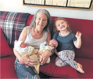  ??  ?? Child Care Now executive director Morna Ballantyne, shown with her newborn granddaugh­ters and their big sister, says $2.5 billion in federal relief funds would set the groundwork for an affordable national child care system that would allow parents who need it to return to work.