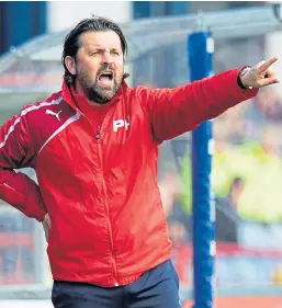  ?? Picture: SNS. ?? Top: Matt Lockwood celebrates scoring against Hearts at Dens Park in 2011. Above: Former Dundee boss Paul Hartley was a poor man-manager, said Lockwood, who applied for the job before Hartley was appointed.