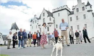  ??  ?? Warm welcome Sarah Troughton, head trustee of Blair Castle and Tony Dowson, coordinato­r, Blair Atholl and District Resilience Group with volunteers on Wednesday, the day the castle grounds reopened on Wednesday 150720Blai­rCastleChe­que_01