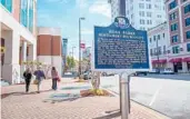  ?? DREAMSTIME ?? A sign marks Rosa Parks’ bus stop in downtown Montgomery, Alabama.