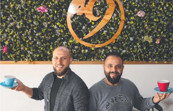  ??  ?? STRONG BELIEF: Cafe owners Ihab and Yamn Housaiki are banking on a strong rebound for the hospitalit­y industry with a new 9 Grams cafe in Torquay adding to their growing footprint in the region. Picture: ALISON WYND