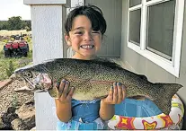  ?? COURTESY PHOTO ?? Makay Tafoya, 4, of Ribera caught this 25-inch rainbow trout June 24 while fishing the Pecos River near Villanueva with her dad using nightcrawl­ers.