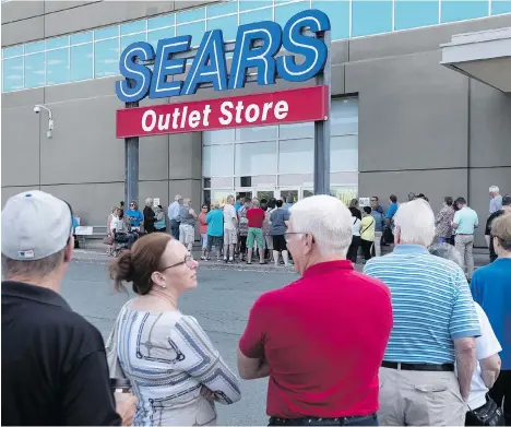  ?? DARREN CALABRESE/THE CANADIAN PRESS ?? Shoppers stand in line waiting for a Sears outlet store to open in Halifax on Friday, when dozens of Sears stores destined for closure began liquidatio­n sales. The ailing retailer is counting on shoppers to scoop up discounted merchandis­e to avoid bankruptcy.