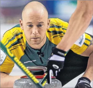  ?? CP PHOTO ?? Northern Ontario third Ryan Fry makes a shot as his team plays Newfoundla­nd and Labrador during action at the Brier in Calgary in 2015.