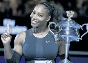  ?? AARON FAVILA/AP FILES ?? Serena Williams holds up a finger and her trophy after defeating her sister, Venus, in the women’s singles final at the Australian Open tennis championsh­ips in January.