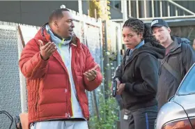  ?? PICTURES SONY ?? Director Deon Taylor, left, and Naomie Harris on the set of “Black and Blue,” a crime thriller opening in theaters Friday. After making successful movies independen­tly for 15 years, Hollywood is starting to take notice of Taylor.