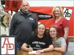  ?? RECORDER PHOTO BY CHIEKO HARA ?? Portervill­e High School’s Shyanne Rainey, second from left, signed a National Letter of Intent to play water polo at Azusa Pacific University Tuesday, Nov. 20, at Portervill­e High School.