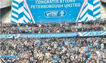  ?? ?? Posh fans celebrate a win at Wembley. Photo David Lowndes.