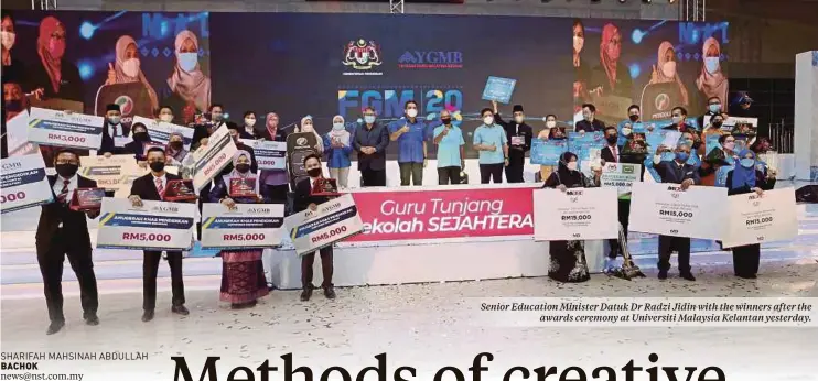  ?? ?? Senior Education Minister Datuk Dr Radzi Jidin with the winners after the awards ceremony at Universiti Malaysia Kelantan yesterday.