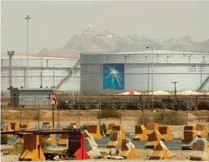  ?? ?? Storage tanks are seen at the North Jiddah bulk plant, an Aramco oil facility, in Jiddah, Saudi Arabia, on March 21, 2021. (AP Photo/Amr Nabil, File)
