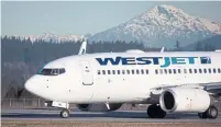  ?? DARRYL DYCK THE CANADIAN PRESS FILE PHOTO ?? Revenue from premium economy passengers shot up 70 per cent last year, WestJet chief executive Ed Sims said.