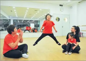  ?? PROVIDED TO CHINA DAILY ?? Zhang Haihan (left) and her club members at a mom-kid dancing rehearsal on March 7 in Shenyang, Liaoning province.