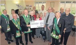  ?? Picture: Gareth Jennings. ?? Dave Munro, vice-chairman of Angus COPD group, accepts a cheque for £300 from Robert Cheyne of Lodge 1252, along with fellow freemasons.