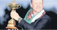 ??  ?? ●● Jamie Donaldson with the Ryder Cup trophy
