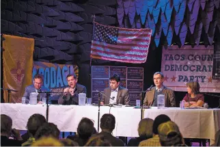  ?? KATHARINE EGLI/THE TAOS NEWS ?? From left, Jeff Apodaca, state Sen. Joe Cervantes, moderator Darien Fernandez, Peter DeBeneditt­is and U.S. Rep. Michelle Lujan Grisham participat­e Tuesday night in the Taos County Democrats’ gubernator­ial forum at Taos Mesa Brewing Co.’s Mothership...