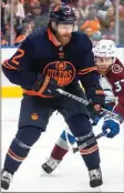  ?? The Canadian Press ?? Edmonton Oilers’ Duncan Keith (2) battle’s Colorado’s J.T. Compher (37) during an NHL playoff game last month. Keith announced his retirement on Friday.