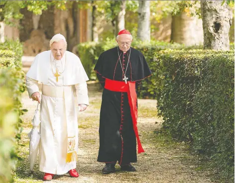  ?? PETER MOUNTAIN ?? Working with a great script, both Anthony Hopkins, left, and Jonathan Pryce give a master class in acting in The Two Popes.