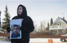  ?? LIAM RICHARDS/THE CANADIAN PRESS ?? Krissa Baptiste holds a photo of her cousin Colten Boushie, who died at 22.