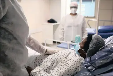  ??  ?? A PATIENT receives attention at Hospital Nilton Lins, in an exclusive treatment area for people with Covid19, in Manaus, Brazil. | BRUNO KELLY Reuters