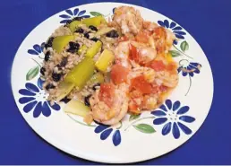  ?? LINDA GASSENHEIM­ER/TNS ?? Greek-Style Shrimp with Lemon Braised Celery is a quick meal made from ingredient­s in the pantry.