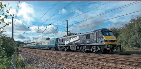  ??  ?? LEFT: DB Cargo 90039 leads the 'Aln Valley Venturer' from London King's Cross to Alnmouth, passing Saltersfor­d, south of Grantham, on August 7, 2021, with 67006 Royal Sovereign on the rear. Paul Clark