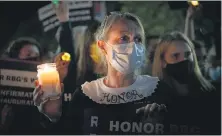  ?? EVELYN HOCKSTEI — THE WASHINGTON PRESS ?? Gwendolyn Howard, of Fairfax, Va., during a vigil for the late Justice Ruth Bader Ginsburg outside the Supreme Court.