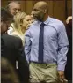  ?? CHRISTIAN GOODEN ST. LOUIS POST-DISPATCH VIA AP ?? Lamar Johnson, center, looks toward friends and family members as his attorneys celebrate on Tuesday.