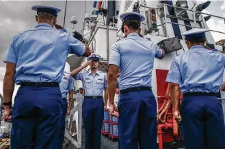  ?? Michael Ciaglo / Houston Chronicle ?? Members of the Coast Guard welcome the official party aboard Thursday during the 50th anniversar­y celebratio­n for the Dauntless. The vessel and crew have participat­ed in many historic events, including the Mariel Boat Lift from Cuba and the Space...