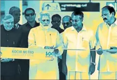  ?? PIB ?? Prime Minister Narendra Modi inaugurati­ng the Kochi Metro with Union minister M Venkaiah Naidu, Kerala chief minister Pinarayi Vijayan and governor P Sathasivam