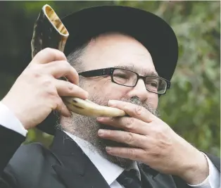  ?? PIERRE OBENDRAUF ?? The shofar is “a simple voice, like that of a baby, wanting to connect,” says Rabbi Yossi Shanowitz, executive director of Chabad of Westmount. The ram's horn is blown during services for Rosh Hashanah.