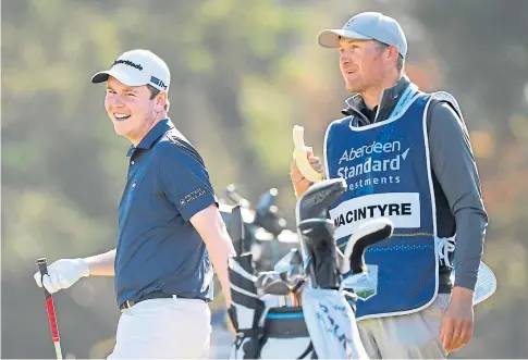  ??  ?? IN CONTROL: Robert MacIntyre played well after a sticky start in the Scottish Open at the Renaissanc­e Club with Mike Thomson on the bag.