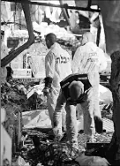  ?? By Oded Balilty, AP ?? Destructio­n: Police inspect the site of a suicide bomb attack Wednesday in Hadera, Israel.