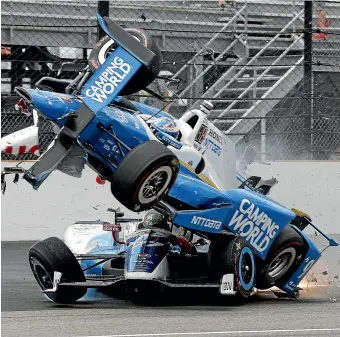  ??  ?? Scott Dixon launches into the air in what was the start of his horrific Indy 500 crash in 2017.